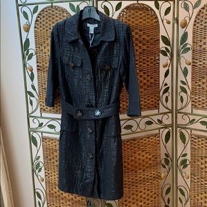 Black rain coat with black lurex detail.